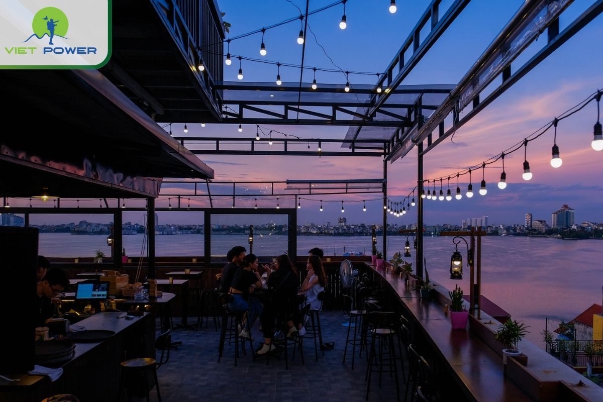 Enjoy a drink and watch the lake shimmering with lights