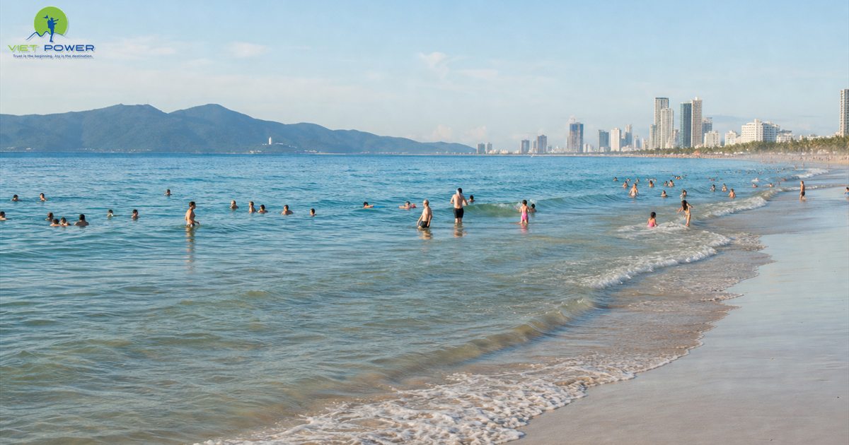 Travelers swimming in the warm sea at My Khe Beach Da Nang