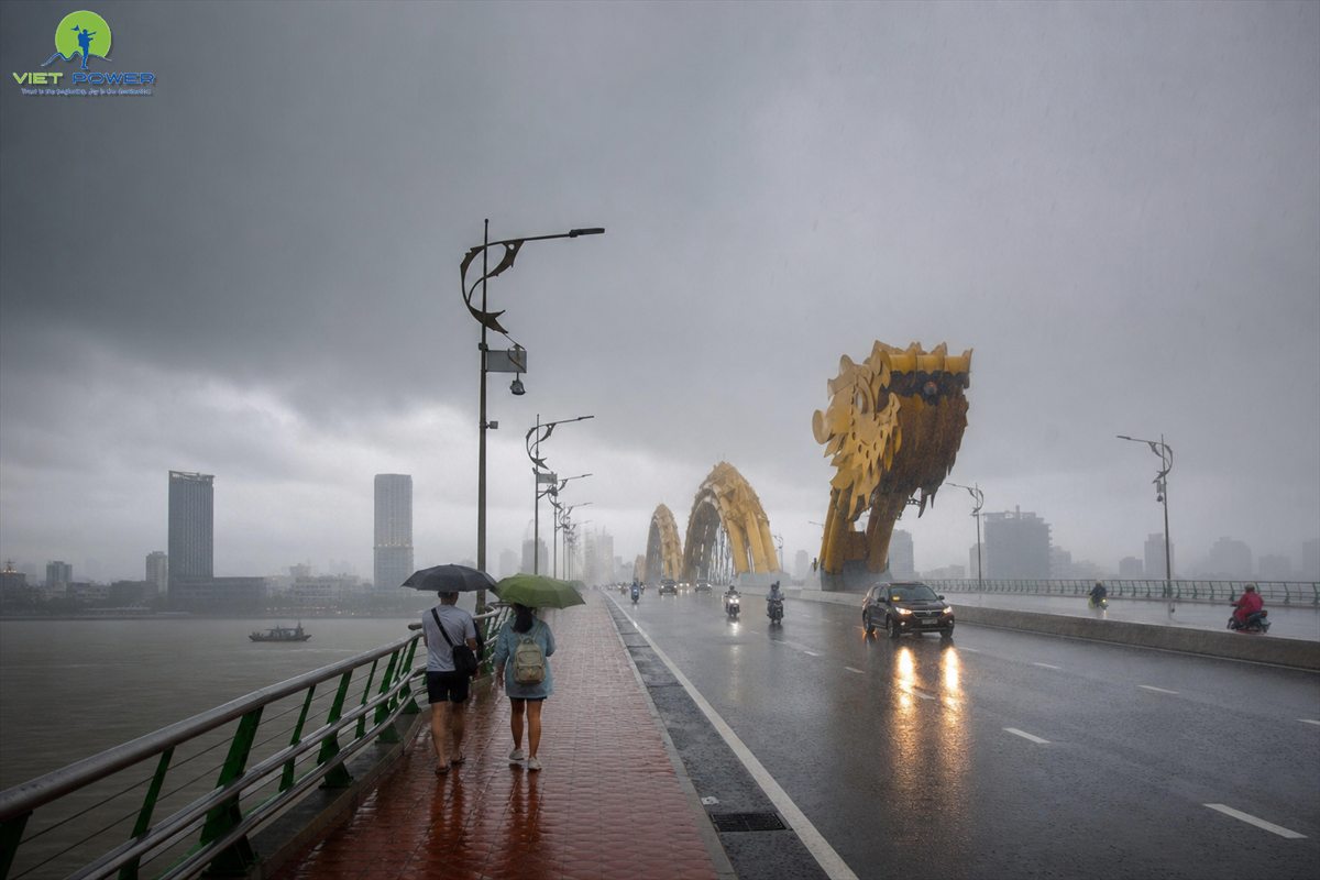 Dragon Bridge in Da Nang during a wet-season tropical rain shower