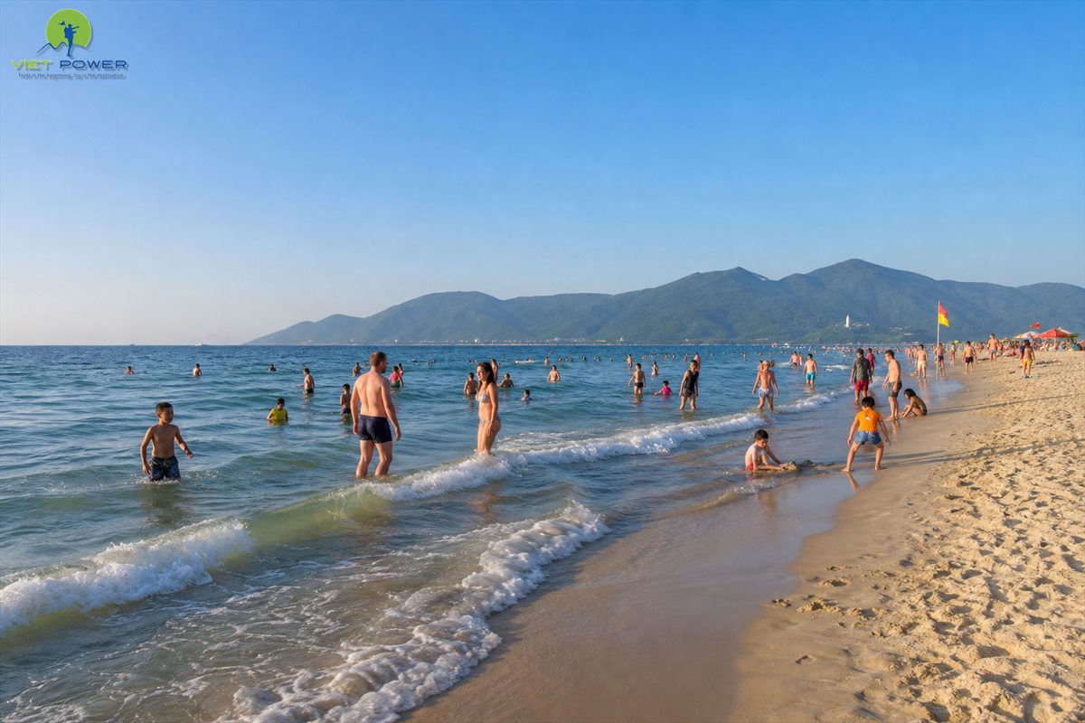 Travellers swimming at My Khe Beach Da Nang during the hot summer season