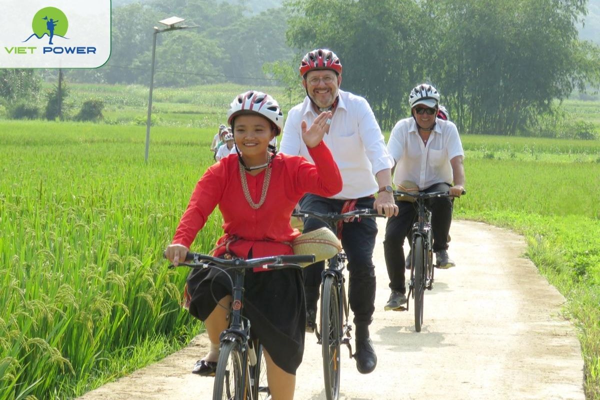 Cycle around the village to see stilt houses